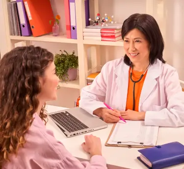 Doctor with patient talking in a medical office during a consultation